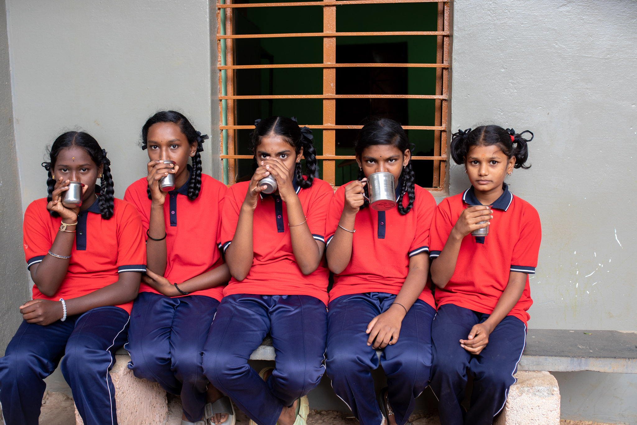 School girls drinking their morning nutrition milk