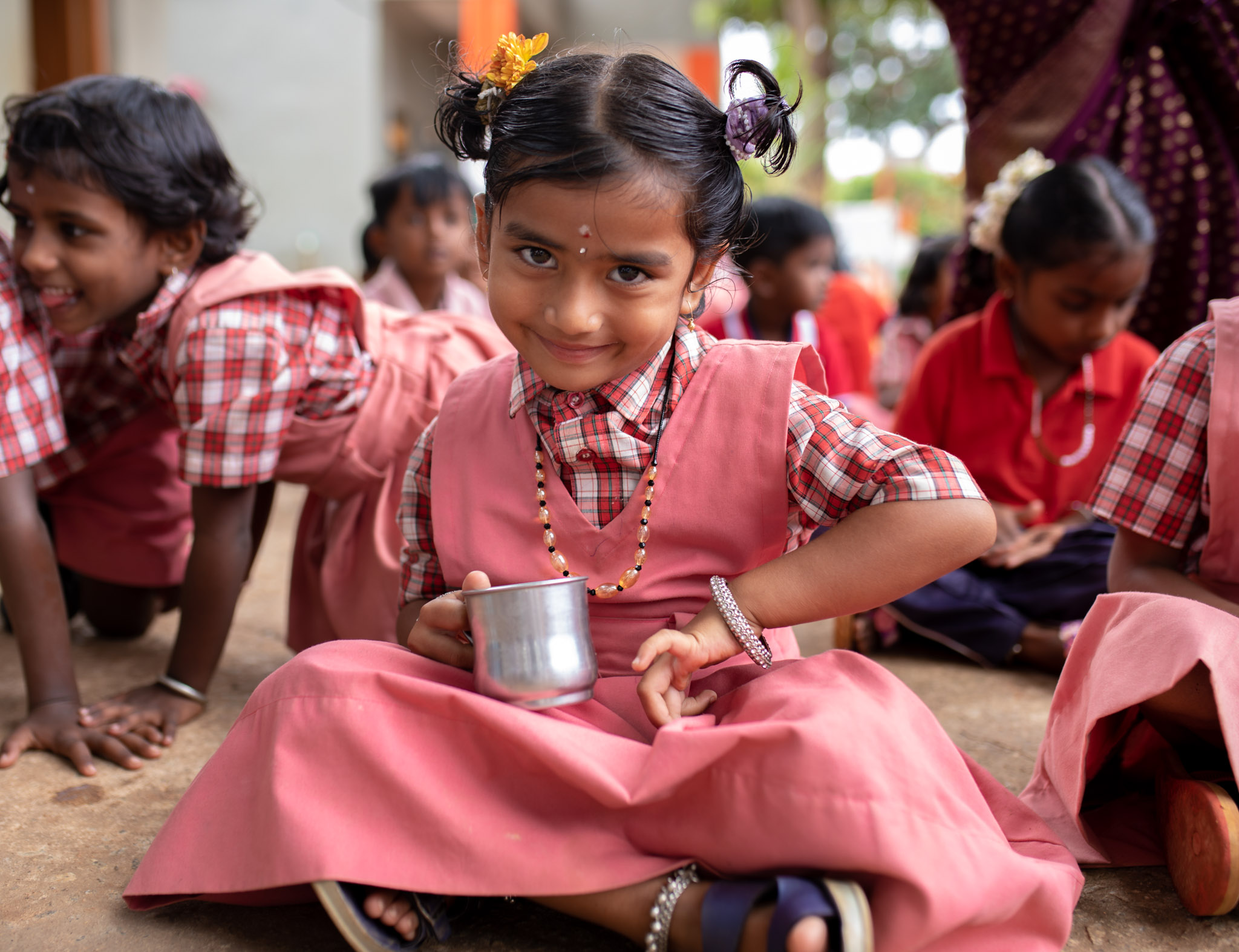 Happy school child with nutrition cup