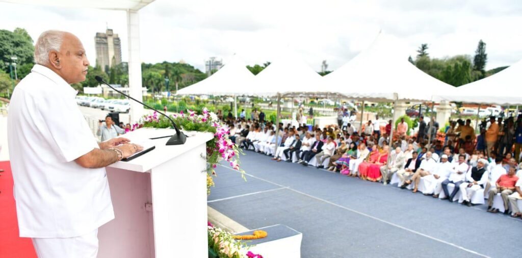 Children, volunteers and officials gather on the steps of Vidhana Soudha, Bengaluru, for the campaign to end malnutrition.